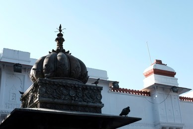 detail of the metal dome on top of a chiseled pavilion in saheliyon ki bari or the garden of maidens in udaipur, rajasthan, india.
