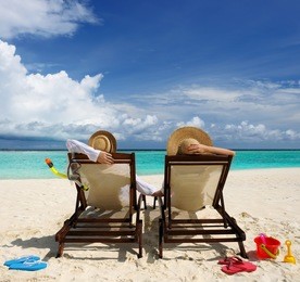 couple on a tropical beach at maldives