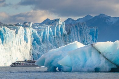 boat sailing near perito moreno glacier, in patagonia, argentina.  el calafate