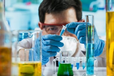 chemist engineer holding test tube in the investigation lab / researcher holding tube pcr in the laboratory
