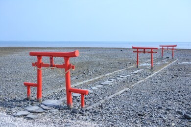 the floating torii gate of ouo shrine in ariake sea, tara town, saga prefecture, japan.(translated text: the god of the sea)