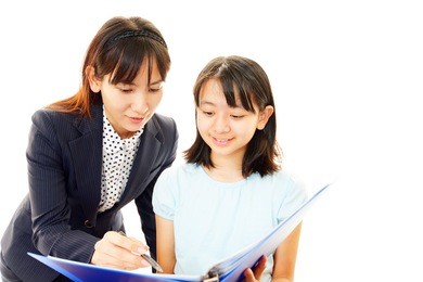 teacher with girl studying.
