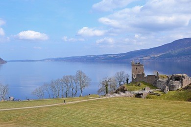 loch ness with urquhart castle in scotland