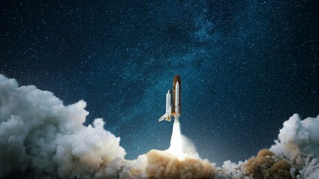 spaceship takes off into the starry sky. rocket starts into space. concept