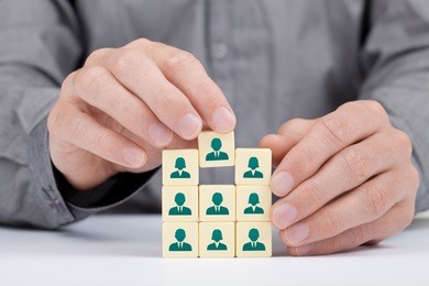human resources, social networking and sales force team concept - recruiter complete team by one person (employee) represented by icon.