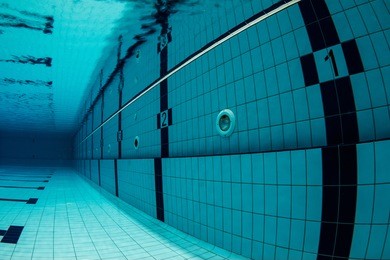 sports swimming pool underwater. lanes underwater, starting with number one. / swimming pool underwater