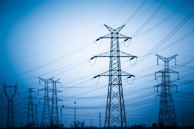 high voltage towers with sky background. blue toned images.