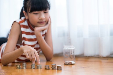 saving money. teenage girl smiling happy with saving money.