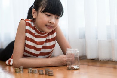 saving money. teenage girl smiling happy with saving money.