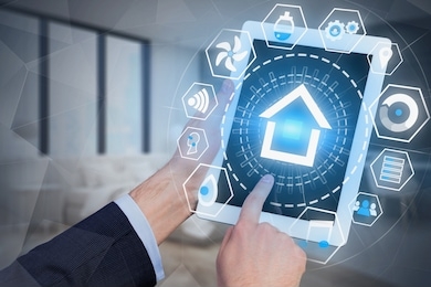 man hands with tablet computer using smart home hud interface over blurred bedroom background. toned image double exposure