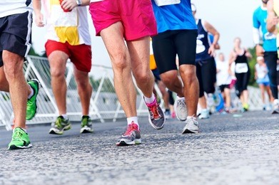 marathon running race people competing in fitness and healthy active lifestyle feet on road