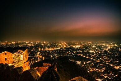 panoramic aerial view of jaipur city also known as pink city during twilight from nahargarh fort, rajasthan, india.