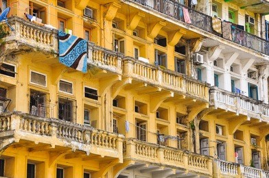a crowded tenement apartment building in yangon, myanmar. yangon is the former capital of myanmar or burma.