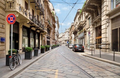 the street with ancient buildings in the center of milan, italy