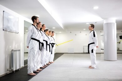 martial art master lining up his taekwondo students for a new class