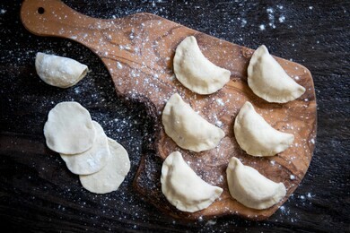 raw dumpling with potatoes. preparation dumplings on a wooden board.