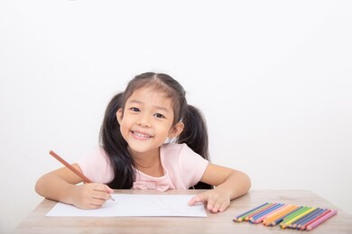 asian children are happy with drawing.  white background. learning concept.