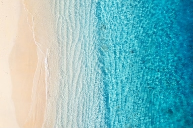 beach and ocean as a background from top view. azure water background from top view. summer seascape from air. gili meno island, indonesia. travel - image