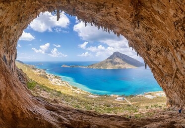 the famous "grande grotta", one of the most popular climbing fields of kalymnos island, greece. in the background, telendos island.