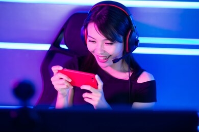 cybersport gamer playing mobile game on the smart phone