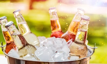 bottles of cold and fresh beer with ice isolated