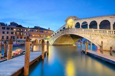 rialto bridge at night in venice, italy
