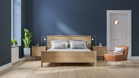 modern mid century and minimalist interior of bedroom ,wood bed and bedside table with  leather armchair on dark blue wall and wood floor ,3d render