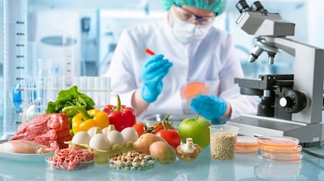 food quality control expert inspecting specimens of groceries in the laboratory