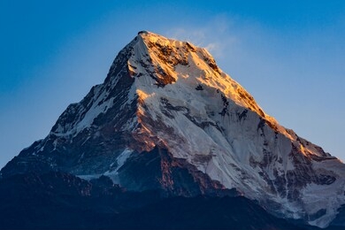 annapurna south  seen from poon hill, the 101st-highest mountain in the world. it is 7,219 metres tall.
