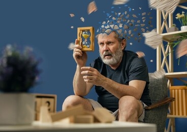 drown image of losing of mind. old bearded man with alzheimer desease has problems with his hands motor skills. illness, memory loss due to dementia, healthcare, neurological disorder, depression.