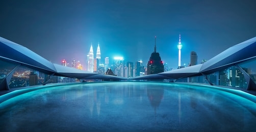 panoramic view of futuristic geometric shapes design empty floor with kuala lumpur city skyline . night scene .