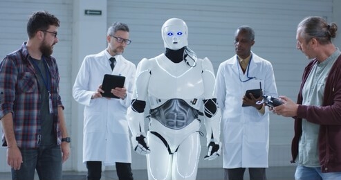 medium shot of scientists testing a humanoid robots movement
