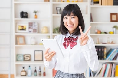 asian girl student using tablet computer