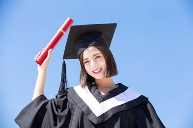 asian graduate student feel happy with sky background