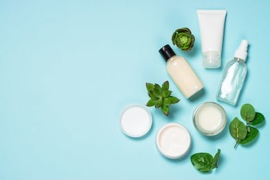 facial cosmetics, skin care product, natural cosmetic, flat lay image on blue.
