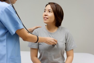 female doctors are checking the heartbeat and sound of the heart by listening through the stethoscope. medical and healthcare concept