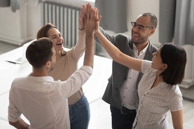 happy motivated diverse business work team people employees group giving high five together engaged in teambuilding celebrate success good teamwork result shared win promise trust integrity concept