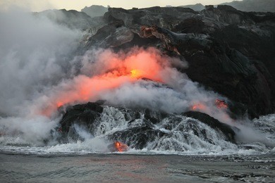 lava flowing  into pacific ocean on big island, hawaii