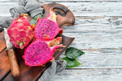 red dragon fruit on a white wooden background. pitahaya tropical fruits
