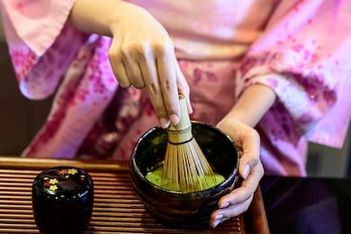 beautiful woman dress in kimono traditional japanese long dress making green tea ,matcha
