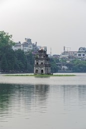 turtle tower (thap rua) in the middle of hoan kiem lake located in hanoi, vietnam