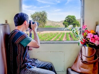 travel concept.traveller take photo from train window traveling trip sightseeing