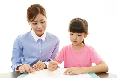 teacher with girl studying.