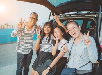 happiness emotion of asian family taking a photograph at vacation traveling destination 