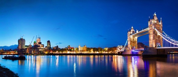 tower bridge in london, the uk at night. panorama of the city centre