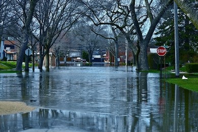 deep flood water in residential area. des plains, il, usa. city under river flood water. nature disasters photography collection.