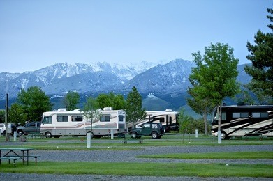 rv park in montana. recreation vehicles in the rv park. montana mountains on the horizon. montana rv trip.