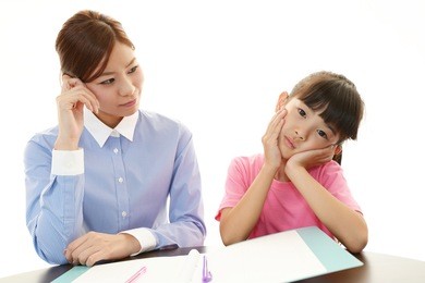 girl studying at the desk being tired