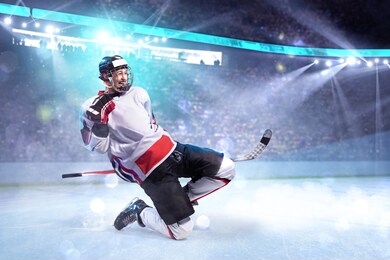 hockey player celebrate goal. he very happy around ice rink arena