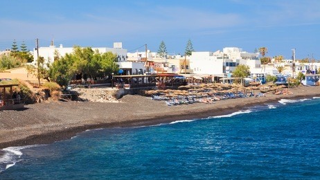 the black volcanic beach at kamari santorini greece